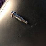 Bolt removed from a tire after causing a slow leak and significant loss of tire pressure.