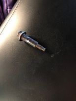 Bolt removed from a tire after causing a slow leak and significant loss of tire pressure.