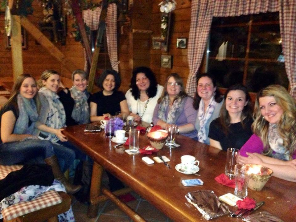 A group of women gathered together around a table during the author's years in Germany.