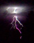 A bright lightning bolt flashes through dark storm clouds during a thunderstorm in Germany