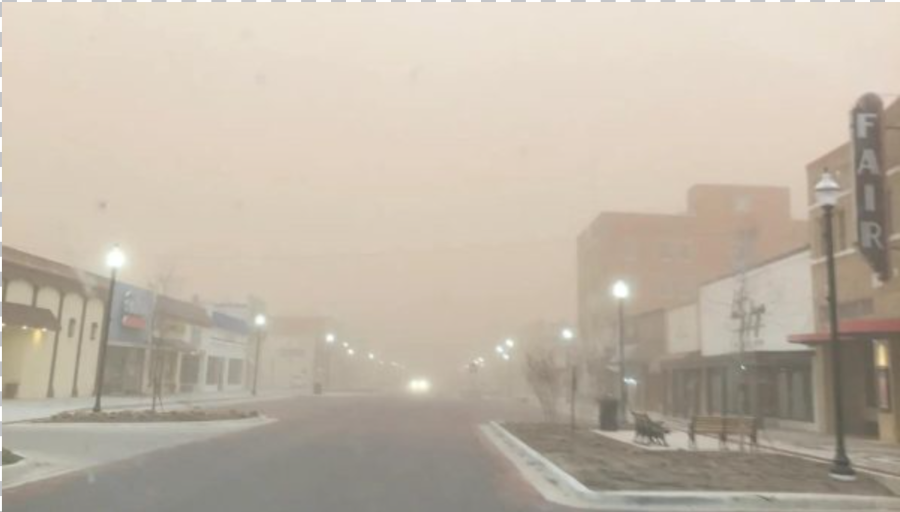 Dirt and wind storm obscuring visibility on a downtown street